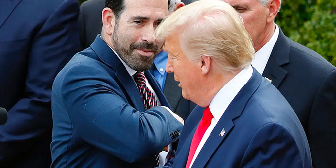 LHC Group's Bruce Greenstein attempts elbow bump with President Donald Trump during a news conference about the coronavirus in the Rose Garden at the White House, Friday, March 13, 2020, in Washington.